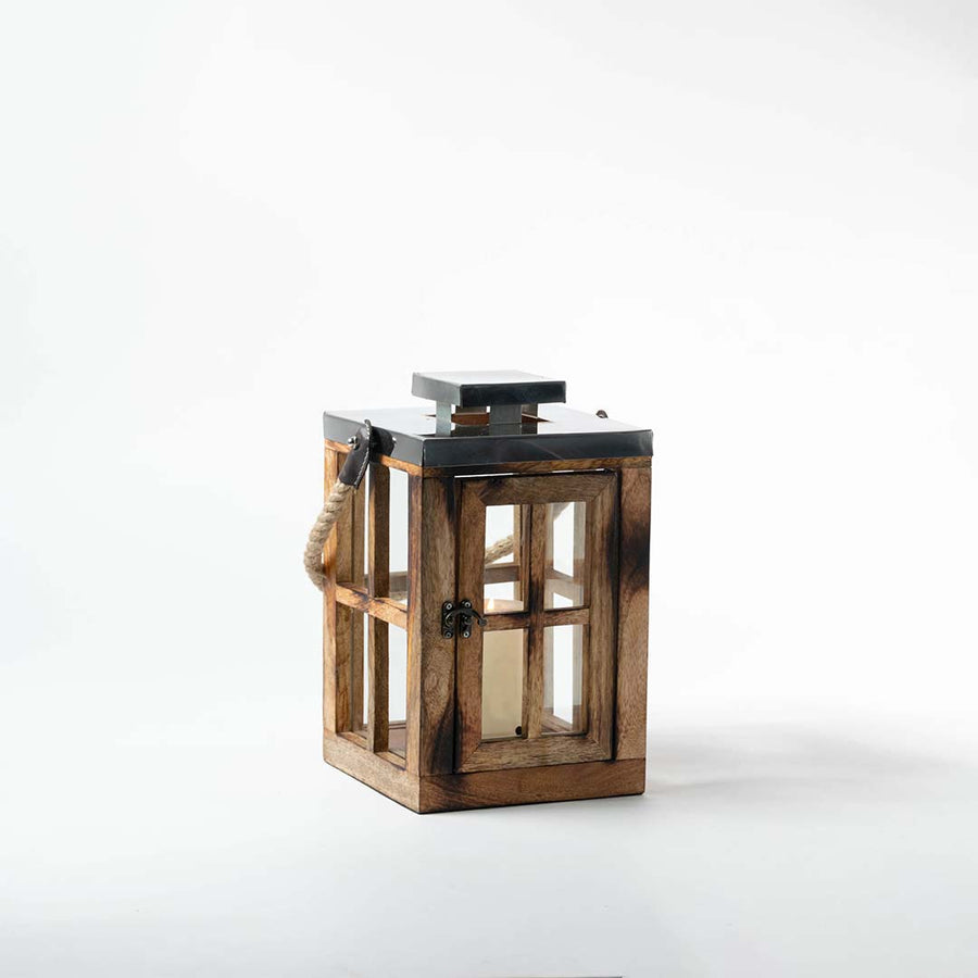 Rustic wooden lantern with clear glass panels and black metal top for tabletop and farmhouse decor styling.