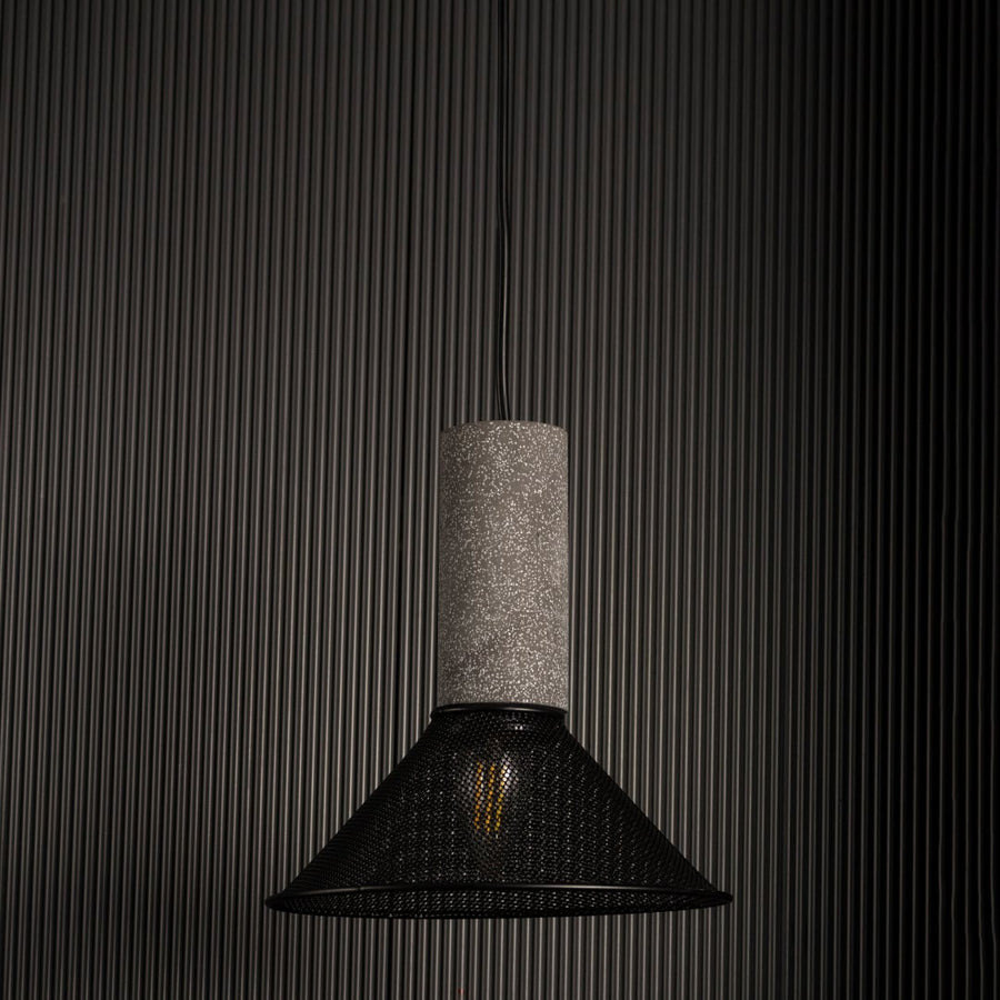 Arlo Cone Mesh pendant light off against a dark background highlighting its warm glow and geometric form.