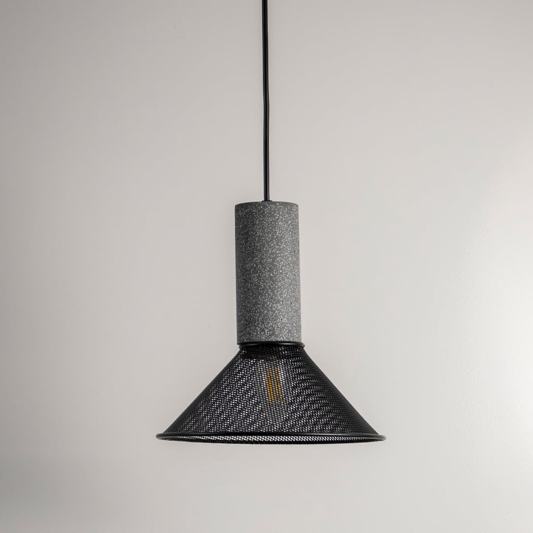 Black metal pendant light with smoky textured glass shade designed for dining and living spaces.