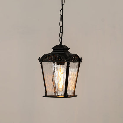 Black hanging lantern with the light on shown on a white background highlighting its bright warm glow clear textured glass and decorative vintage metal frame.
