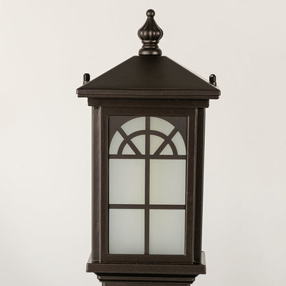 Black outdoor lantern Closeup seeded glass Light On showing the warm ambient glow and decorative pebbled glass panels detail.