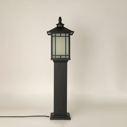 A black outdoor pillar lamp shown on a white background with the light off highlighting its structured frame frosted glass panels and sturdy base in full detail.
