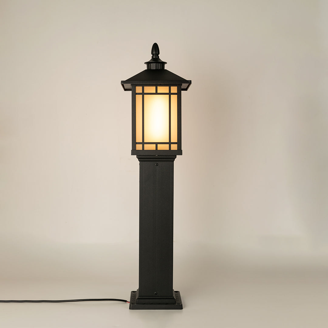 Black outdoor gate light with frosted glowing panels for stylish modern exterior decor use.
