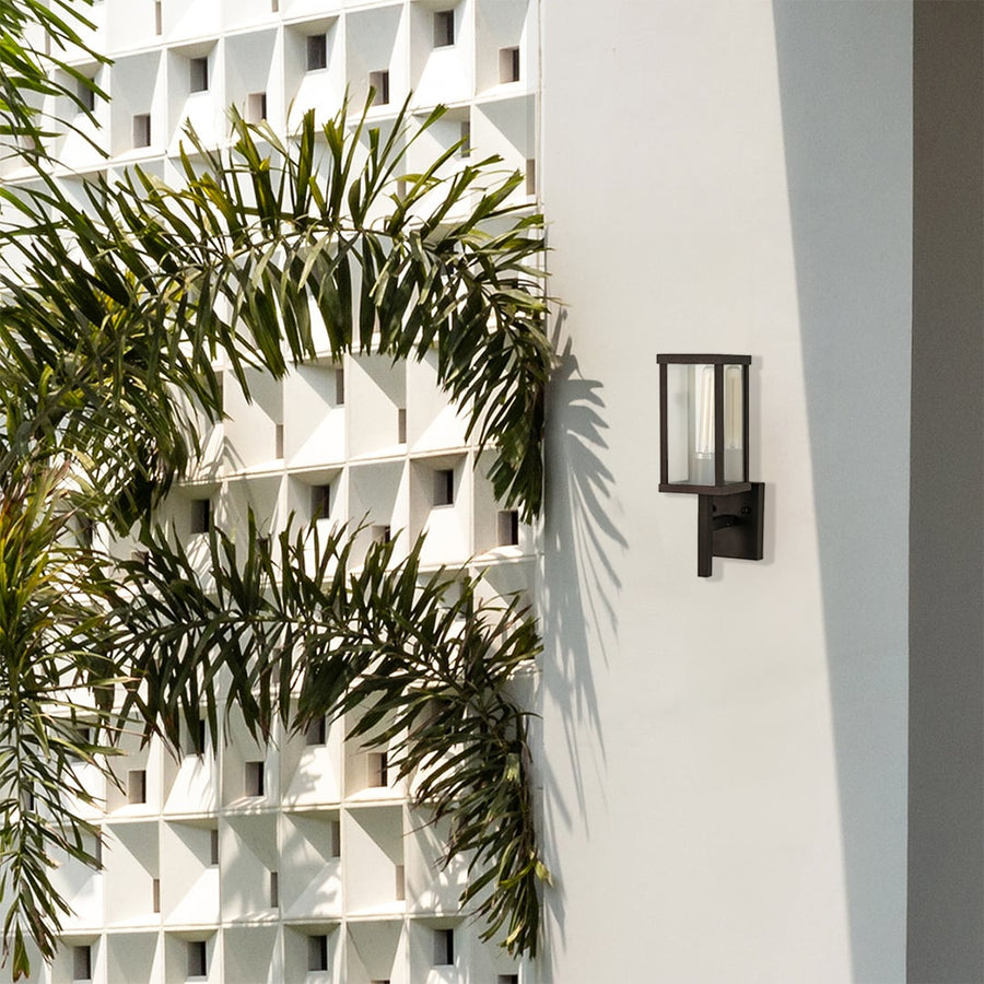 Sleek black outdoor wall light placed on a bright exterior wall enhancing modern outdoor decor with clean lines and soft ambient lighting.