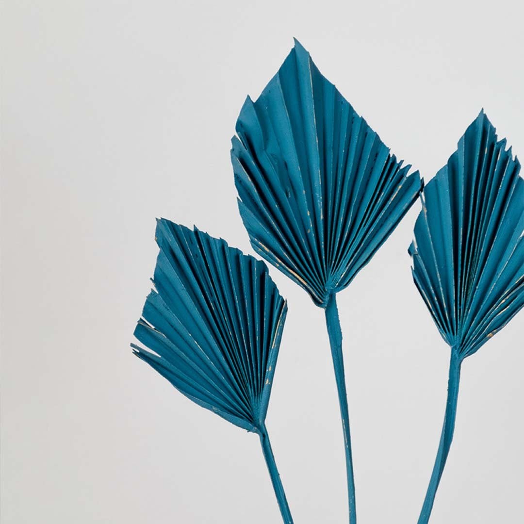 Closeup of blue decorative leaf stems showcasing detailed texture and vibrant color for modern home decor accents.