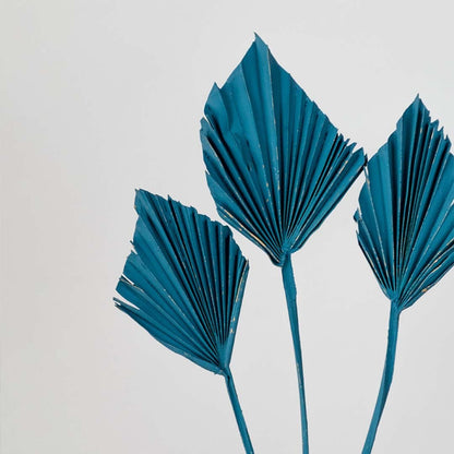 Closeup of blue decorative leaf stems showcasing detailed texture and vibrant color for modern home decor accents.