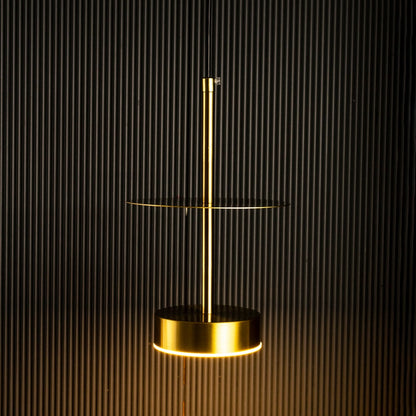 Closeup of halo brass pendant light turned off showing fine brass texture and circular pendant detailing.