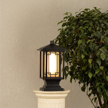 Black outdoor gate light with warm ambient glow for stylish exterior decor styling use.