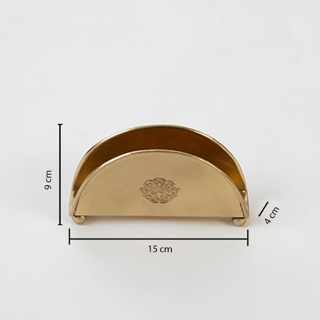 Brass napkin holder shown with labeled size 9 cm height 15.5 cm width and 4.5 cm depth on white background.