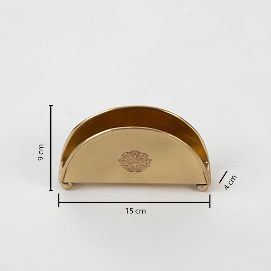 Brass napkin holder shown with labeled size 9 cm height 15.5 cm width and 4.5 cm depth on white background.
