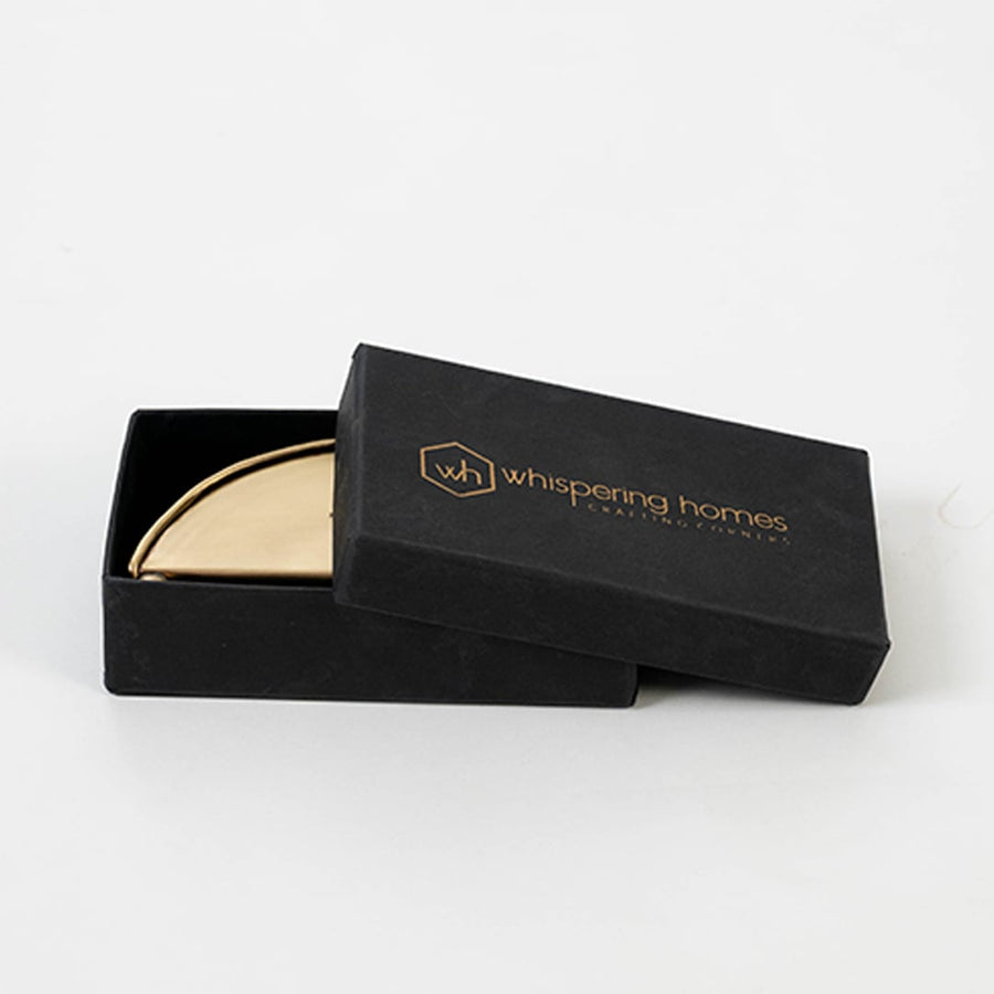 Brass napkin holder packed neatly inside premium black box with soft inserts ideal for gifting and protective storage.