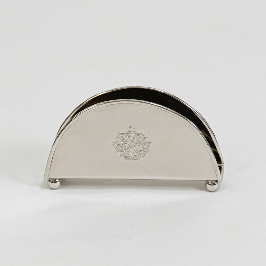 Half-round brass napkin holder with floral crest placed on white background showcasing finish and elegant shape.