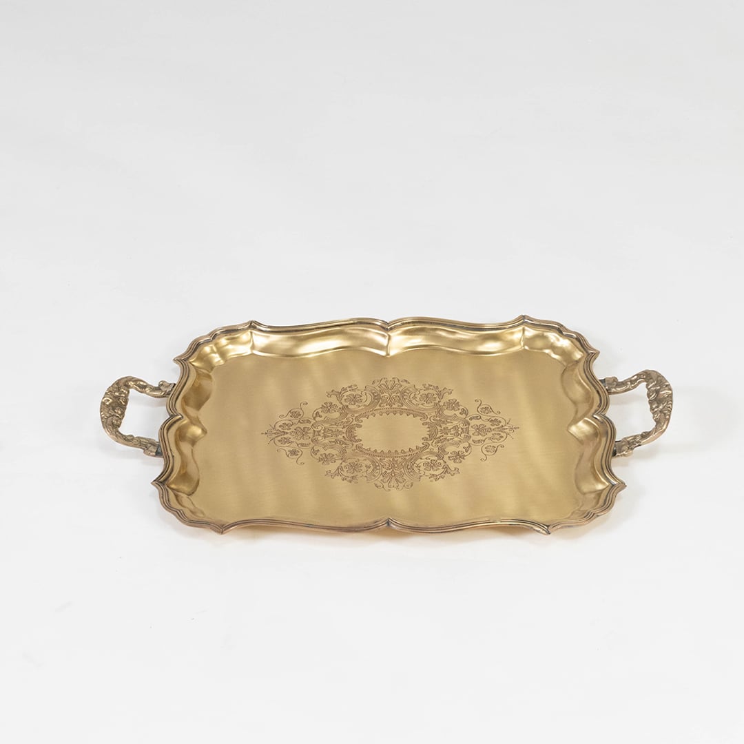 Antique brass floral tray styled with dry fruits and decorative accents on a white table setting for festive decor.