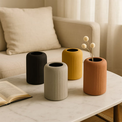 Yellow textured ceramic vase styled in a warm neutral setup adding a bright modern touch to home decor settings.