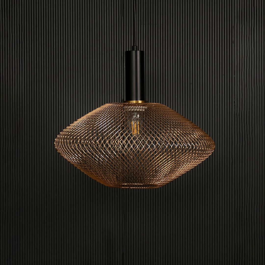 Gold metal mesh pendant light with black fixture adding modern elegance to interiors.