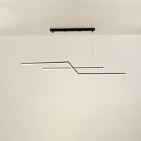 Black linear pendant light with sleek illuminated bars forming a structured geometric silhouette that enhances the room with a clean modern decorative lighting element.