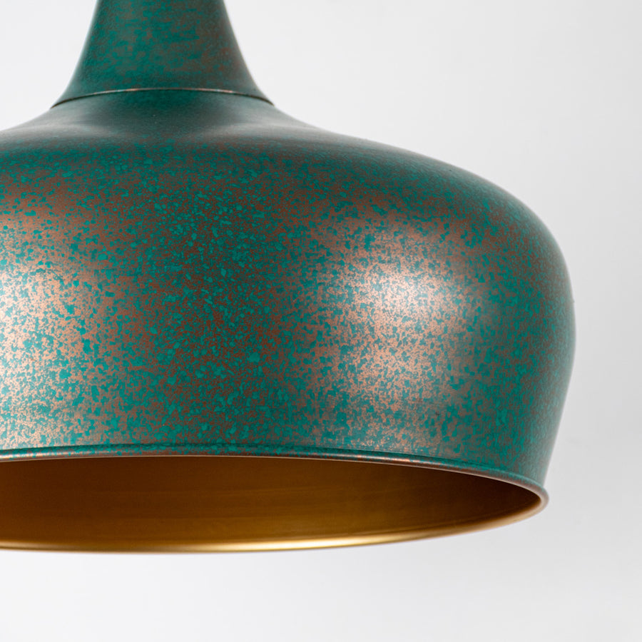 Closeup image of green textured metal pendant light with hammered finish for elegant ceiling placement.