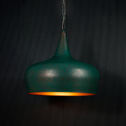 Green metal pendant light with matte textured finish adding modern charm to home interiors.