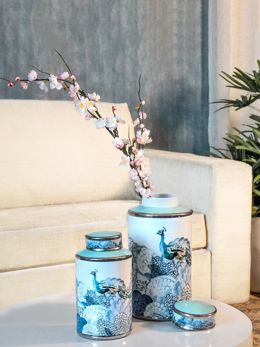 Set of blue floral porcelain jars arranged on a wooden surface delivering timeless decorative elegance ideal for enhancing classic living room or shelf décor settings.