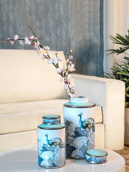 Set of blue floral porcelain jars arranged on a wooden surface delivering timeless decorative elegance ideal for enhancing classic living room or shelf décor settings.
