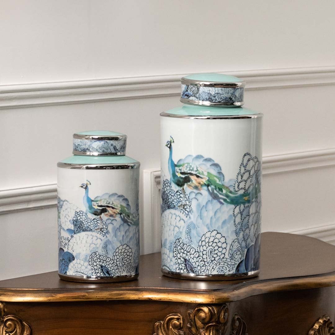White ceramic jars with blue scenic artwork perfect for sophisticated living room décor and decorative display styling.