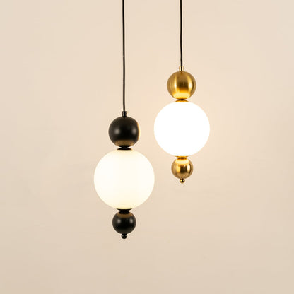 Black and gold metal wall lights illuminated to showcase sophisticated modern wall lighting with refined elegance.