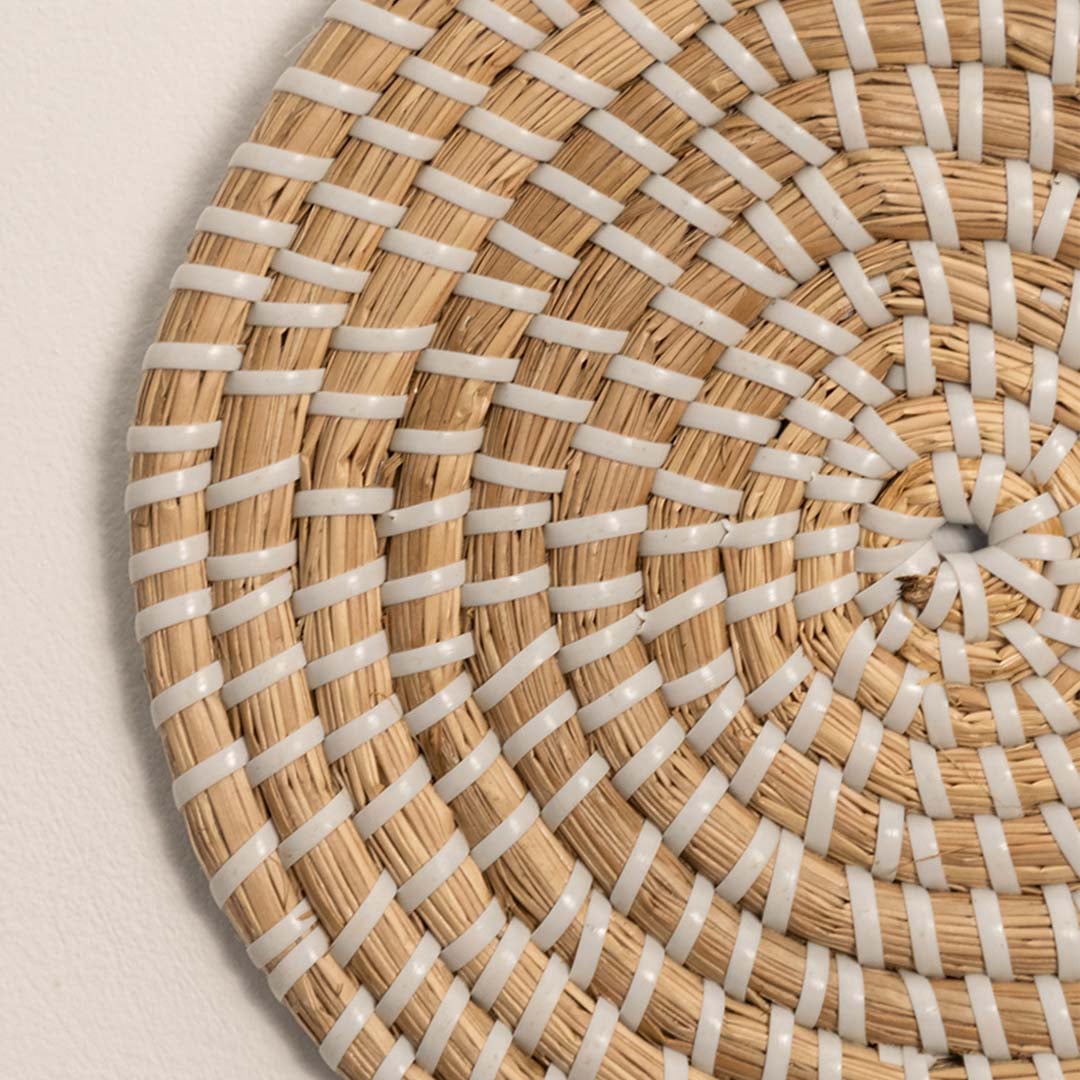 Detailed closeup of woven wall plate texture showing intricate handwoven fiber patterns and craftsmanship.