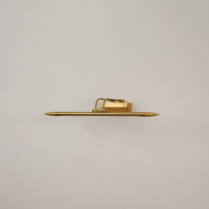 Gold metal picture light on a white background with the light off highlighting its minimal modern design.