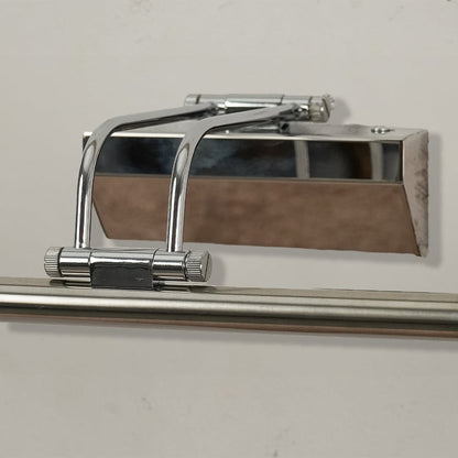 Closeup of chrome metal picture light showing polished finish slim bar design and warm directional illumination.