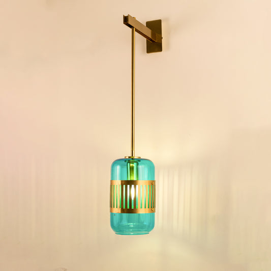 Modern turquoise glass pendant wall light with warm glow for stylish bedroom and luxury decor spaces.

