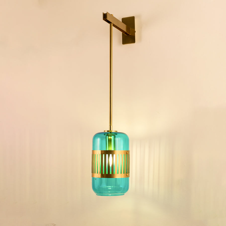 Modern turquoise glass pendant wall light with warm glow for stylish bedroom and luxury decor spaces.


