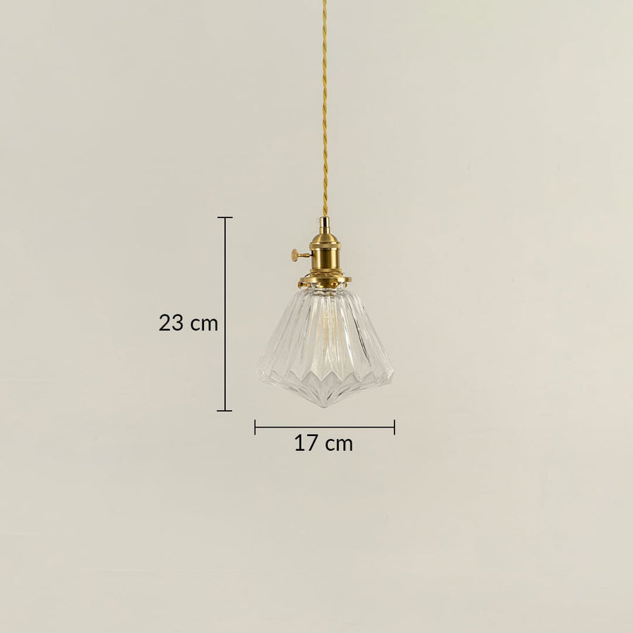 Clear glass pendant light with brass top shown with 23 cm height and 17 cm width dimension detail for decorative use.