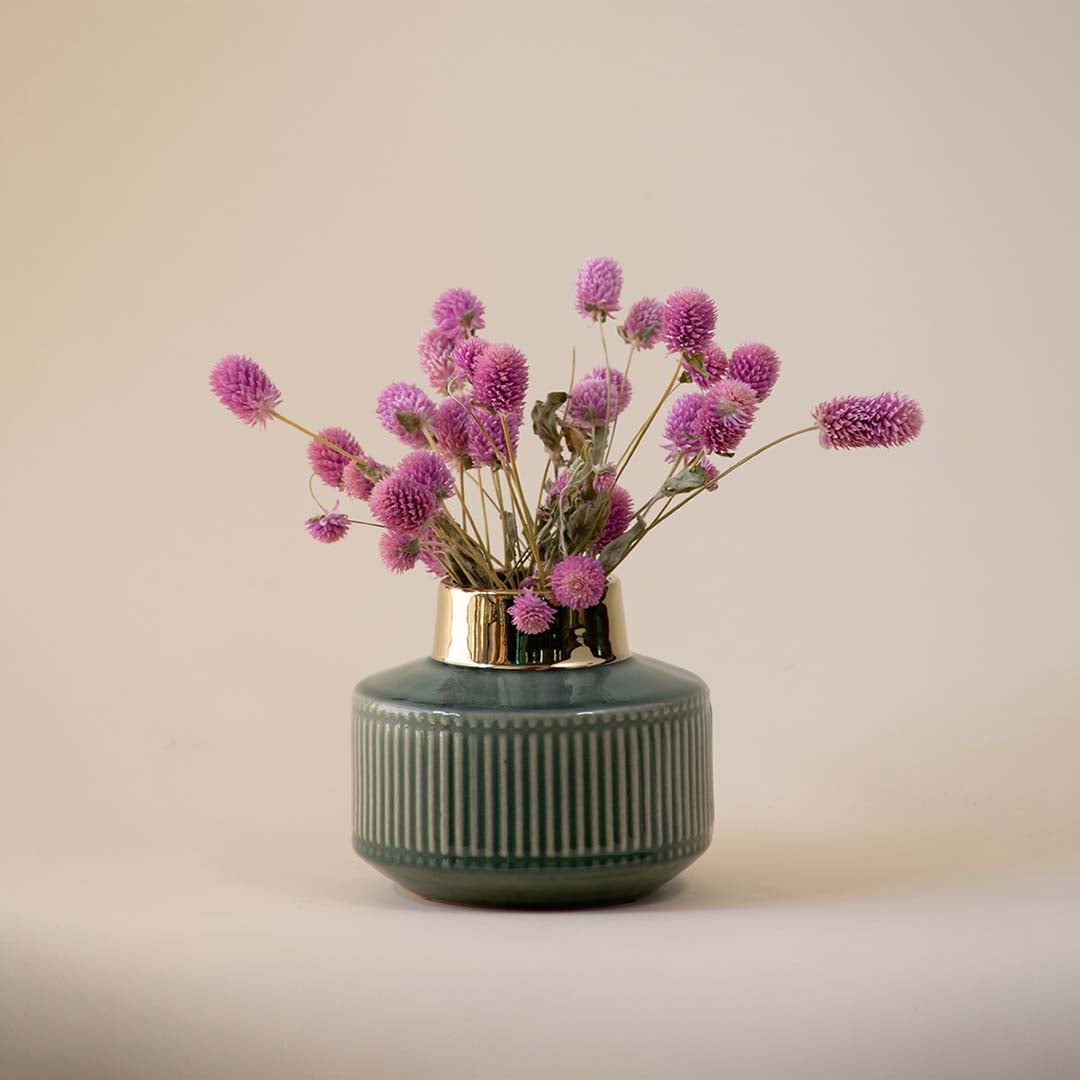 Green ribbed ceramic decor vase with gold rim styled as a compact accent piece ideal for modern shelves side tables and elegant home interiors.