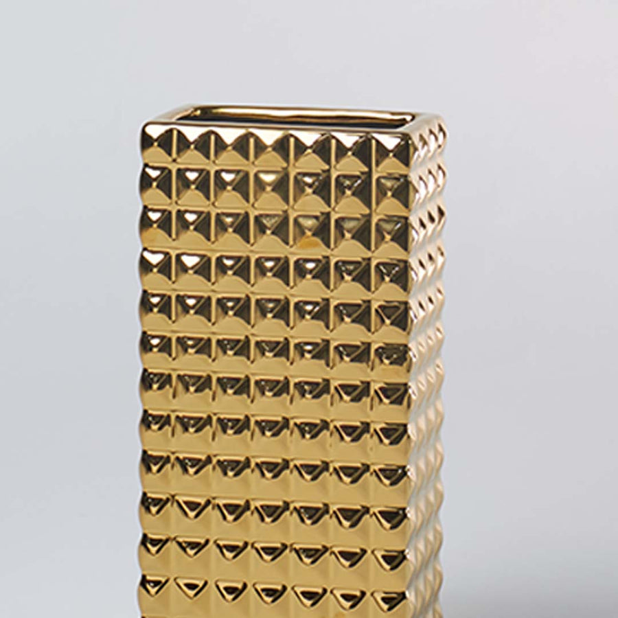 Closeup view of the gold geometric ceramic vase showing detailed textured surface and glossy finish for premium modern home styling.