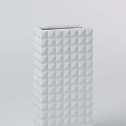 Closeup view of the white textured ceramic vase highlighting its geometric pattern and smooth matte finish for elegant modern styling.