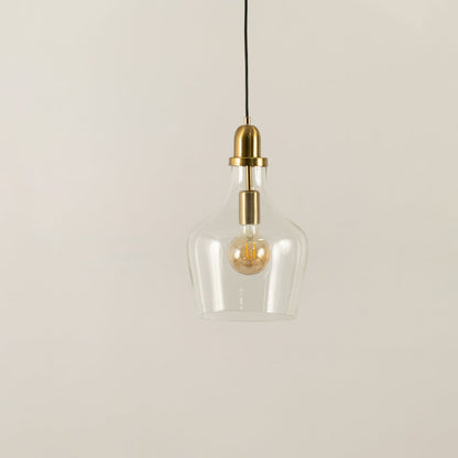 Clear glass and brass metal pendant light with minimalist styling for refined modern interiors.