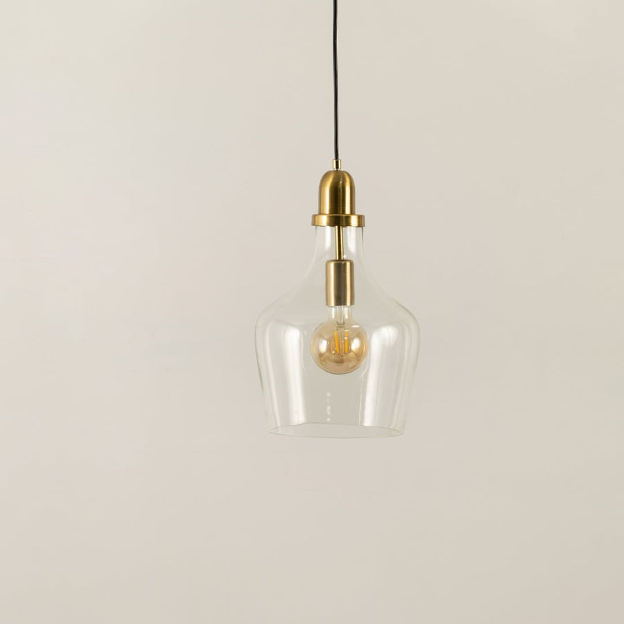 Clear glass and brass metal pendant light with minimalist styling for refined modern interiors.
