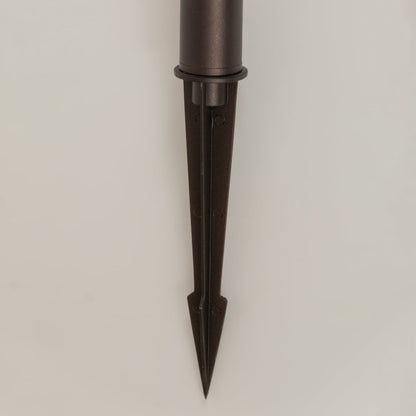 Closeup of brown solar garden lantern showing patterned glass panels and classic carved detailing ideal for warm decorative outdoor lighting.