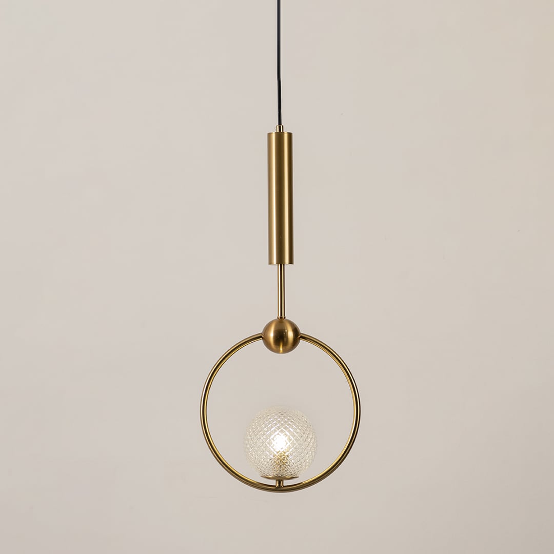 Gold ring pendant light with textured glass globe glowing on a white background for modern ceiling lighting decor.