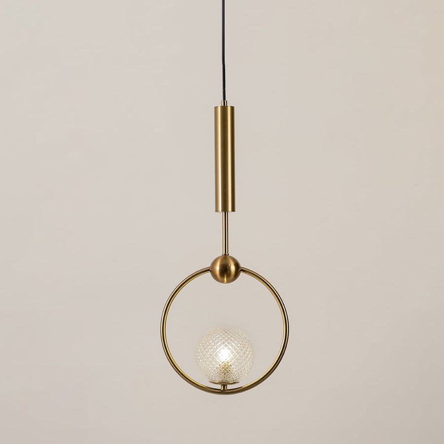 Gold ring pendant light with textured glass globe glowing on a white background for modern ceiling lighting decor.