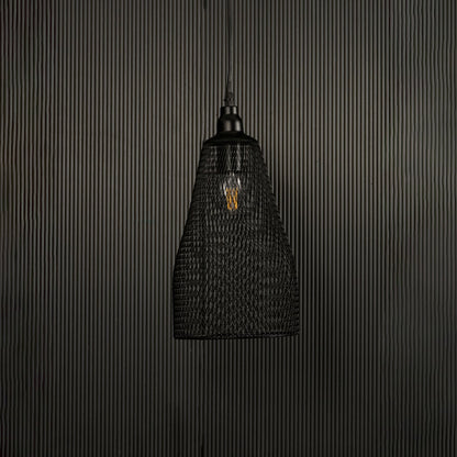 Contemporary black mesh metal pendant light displayed on dark background with lights off highlighting artistic industrial elegance.