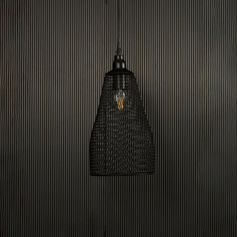 Contemporary black mesh metal pendant light displayed on dark background with lights off highlighting artistic industrial elegance.
