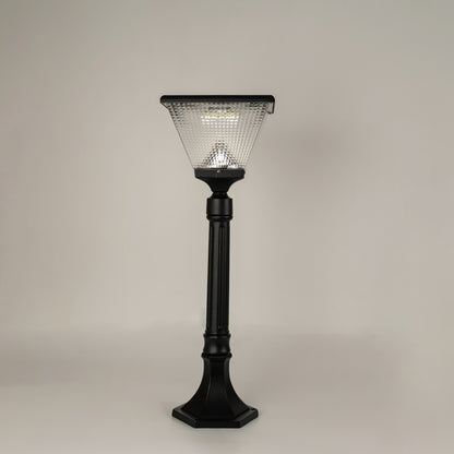 Modern black outdoor bollard light with textured glass shade for elegant exterior decor styling use.
