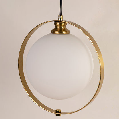 Closeup of gold metal pendant light with circular frame and glass globe on white background ideal for premium interior decor.