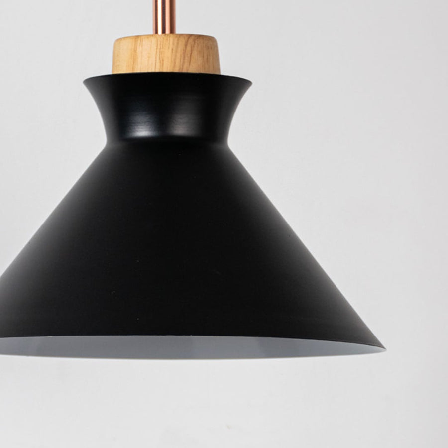 Black metal pendant light with natural wood detailing showcasing sleek cone shape and modern Scandinavian style.