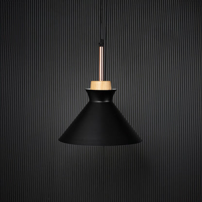 Black conical pendant ceiling light with wooden top switched off on back background for modern dining room cafe and living space lighting.