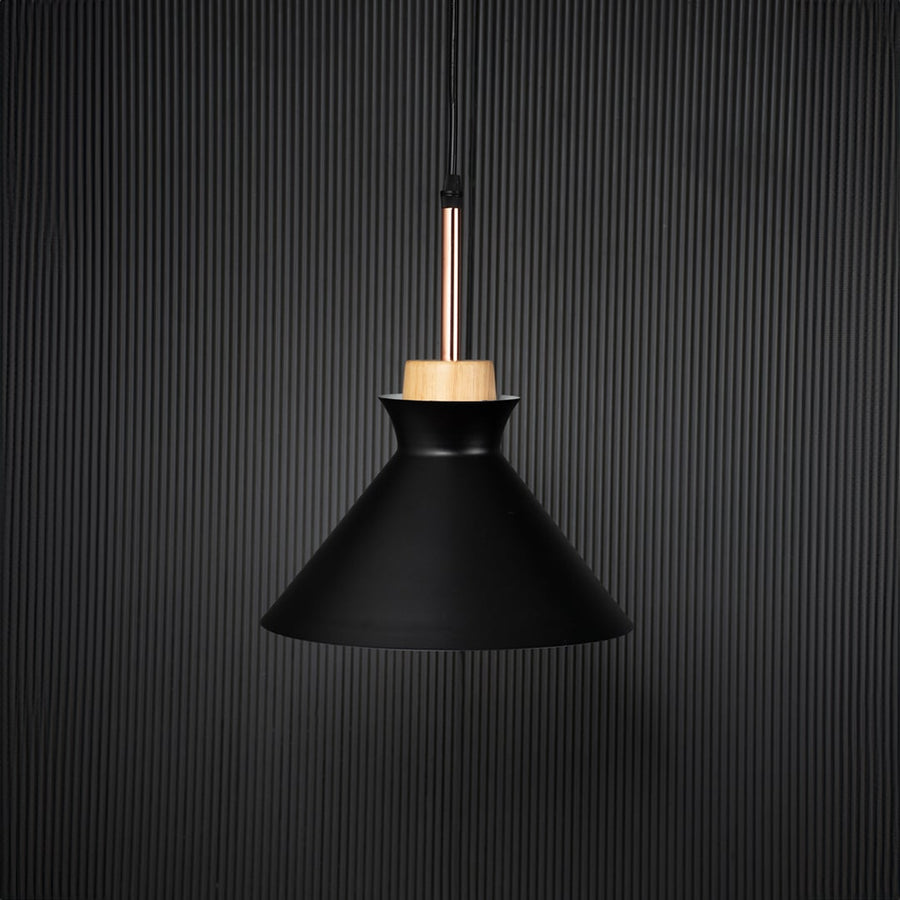 Black conical pendant ceiling light with wooden top switched off on back background for modern dining room cafe and living space lighting.