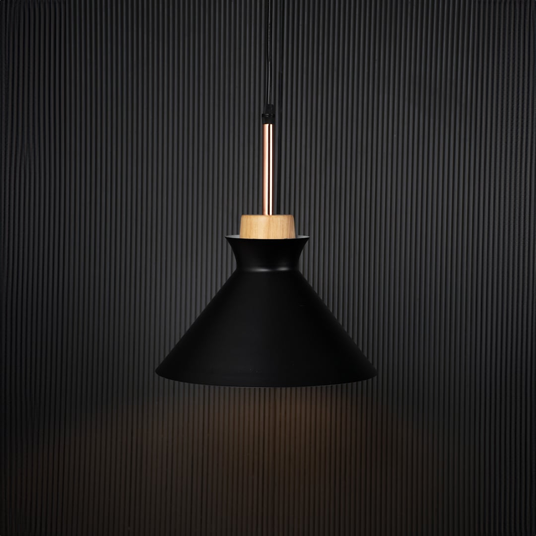 Black conical pendant ceiling light with wooden accent illuminated on back background for modern dining room cafe and living decor lighting.