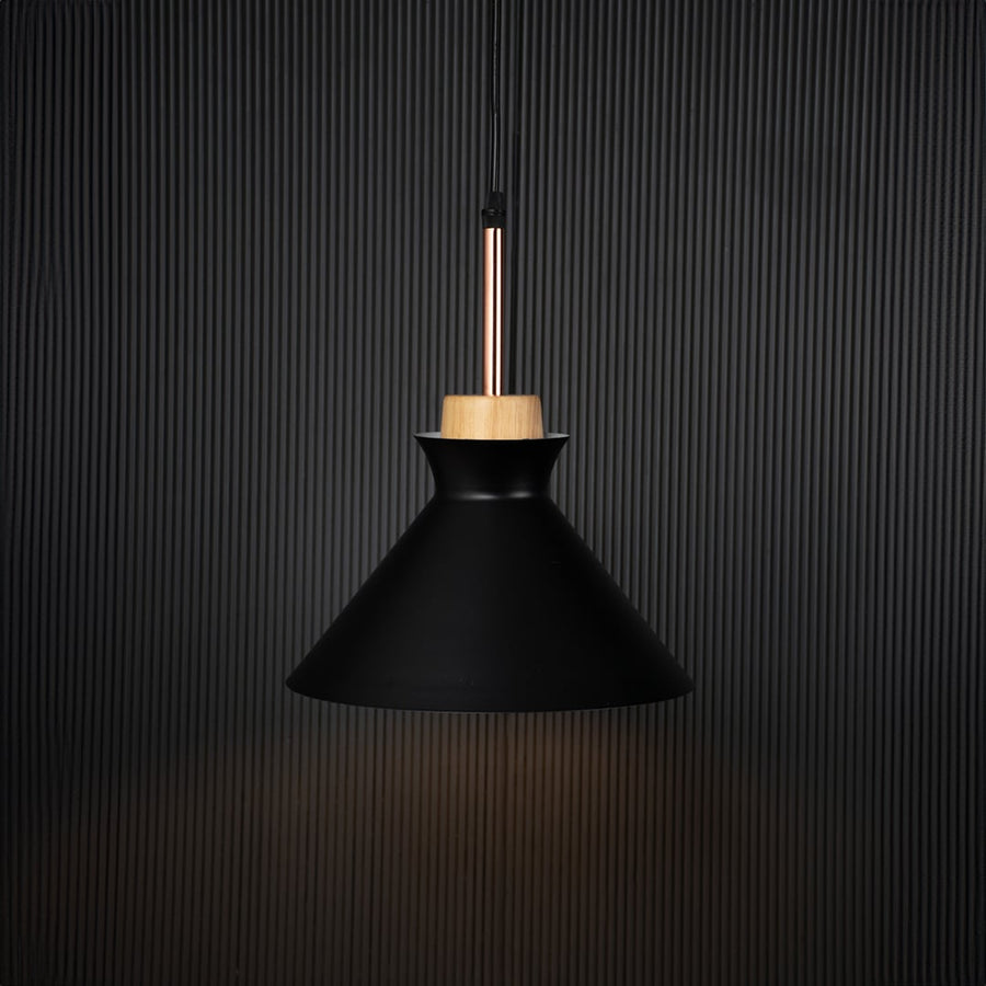 Black conical pendant ceiling light with wooden accent illuminated on back background for modern dining room cafe and living decor lighting.