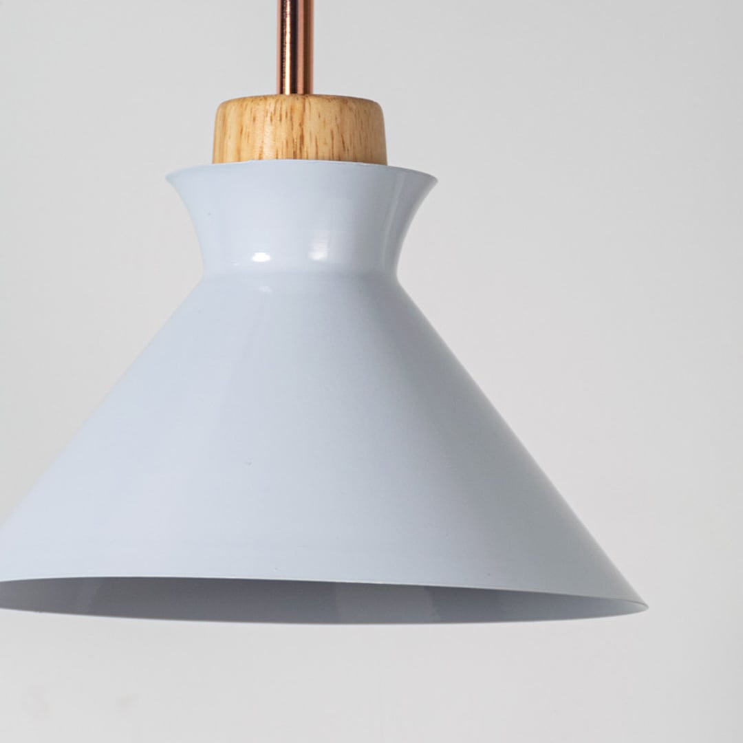Closeup of white conical pendant ceiling light with wooden accent showing glossy finish for modern dining kitchen and cafe decor lighting.